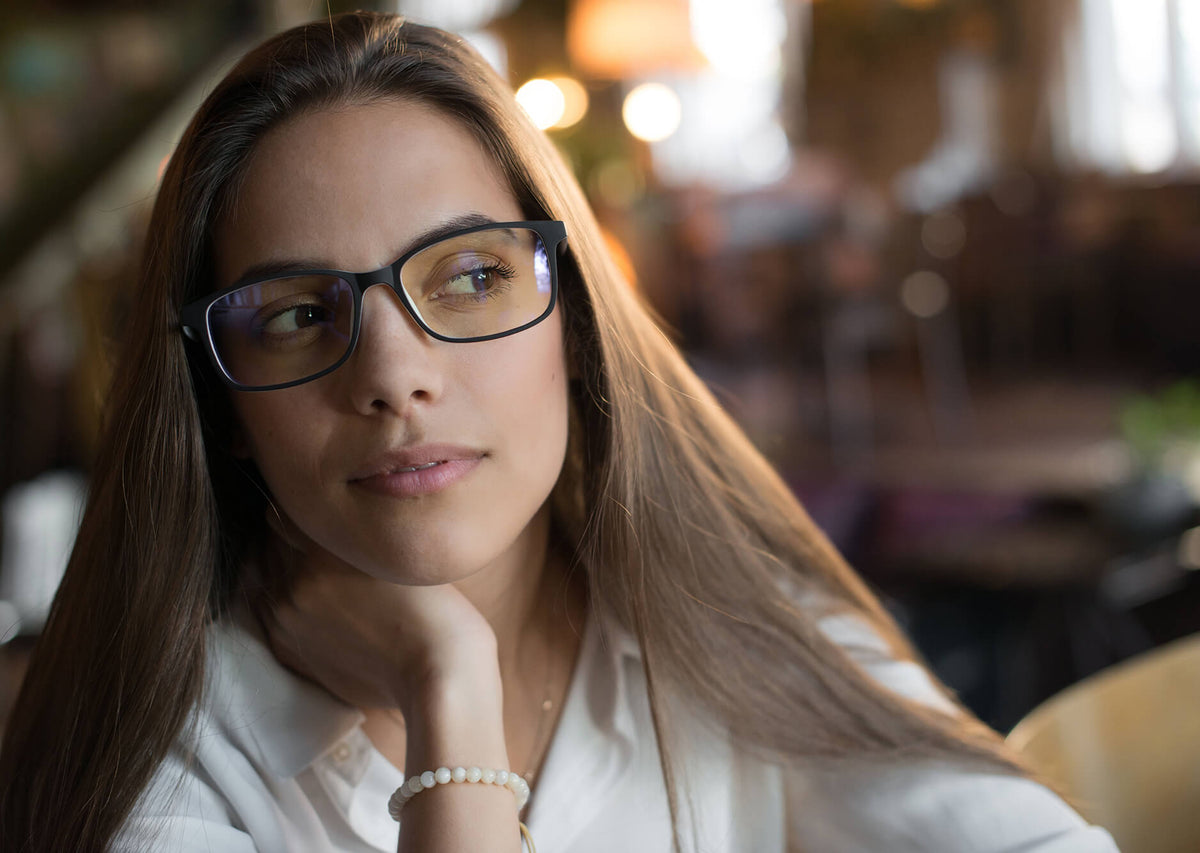 Woman wearing dark-framed Spektrum glasses